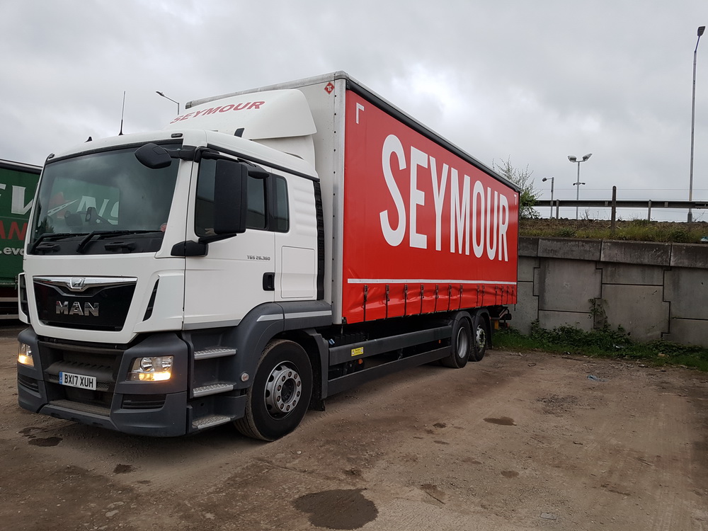 New Seymour Transport 6-wheel rigid curtain MAN truck.